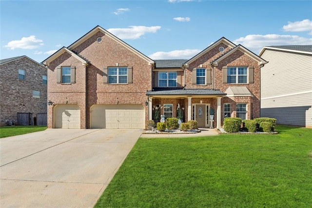 view of front of house with a garage and a front lawn