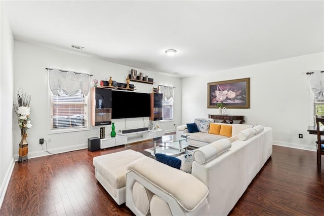 living room with dark hardwood / wood-style flooring