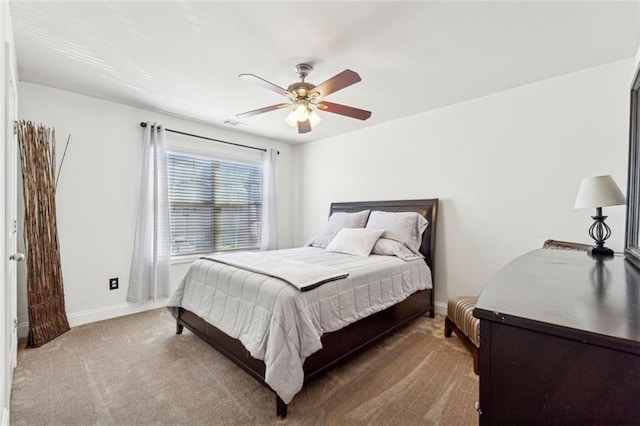 bedroom with ceiling fan and carpet floors