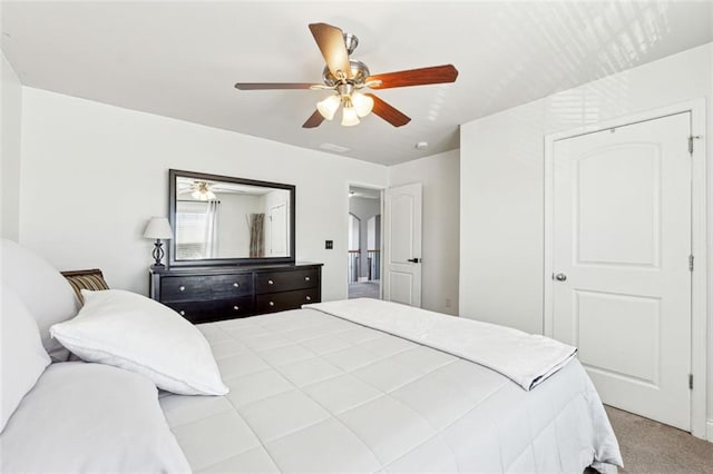 carpeted bedroom with ceiling fan