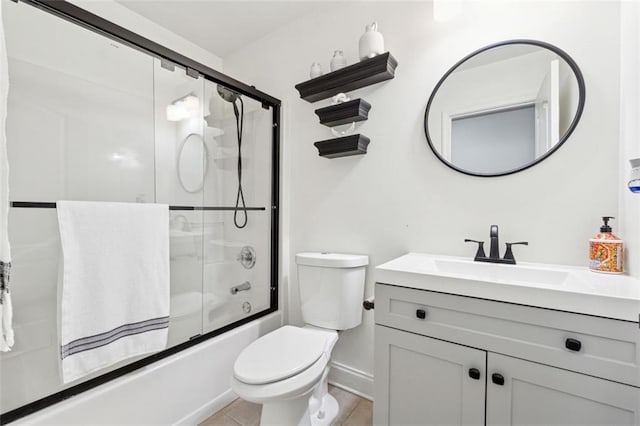 full bathroom with tile patterned flooring, enclosed tub / shower combo, vanity, and toilet