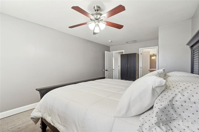 bedroom with light colored carpet and ceiling fan