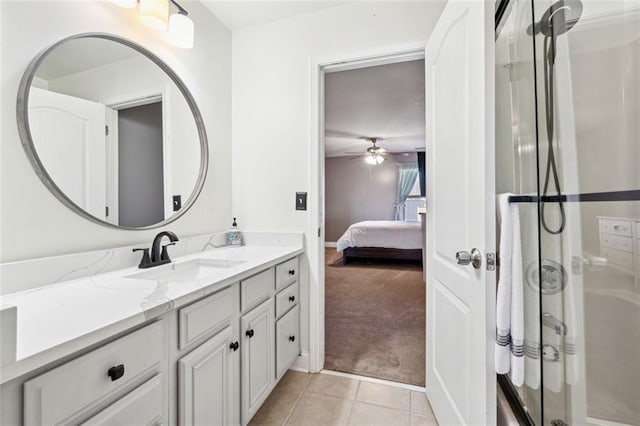 bathroom with an enclosed shower, vanity, tile patterned floors, and ceiling fan