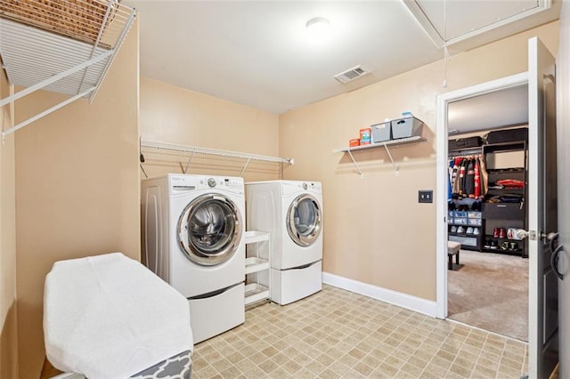 laundry area featuring independent washer and dryer