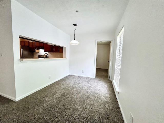 interior space with dark colored carpet