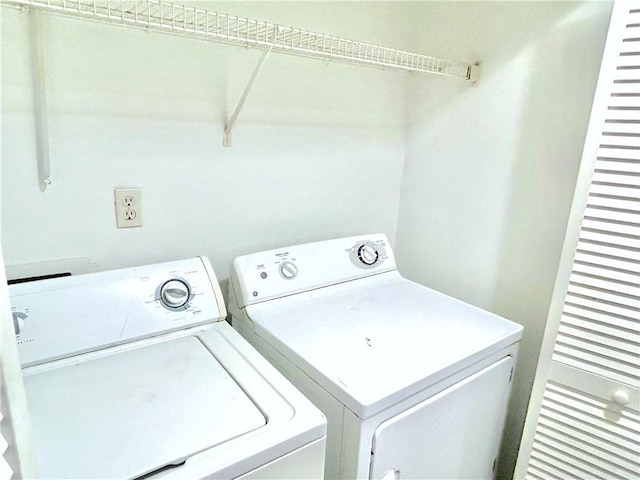 washroom with washer and dryer