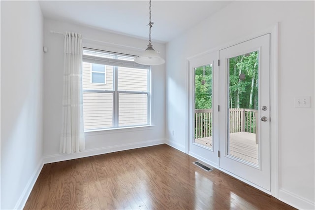 3690 Dalwood Dr, Suwanee, GA 30024 - unfurnished dining area featuring dark wood-type flooring