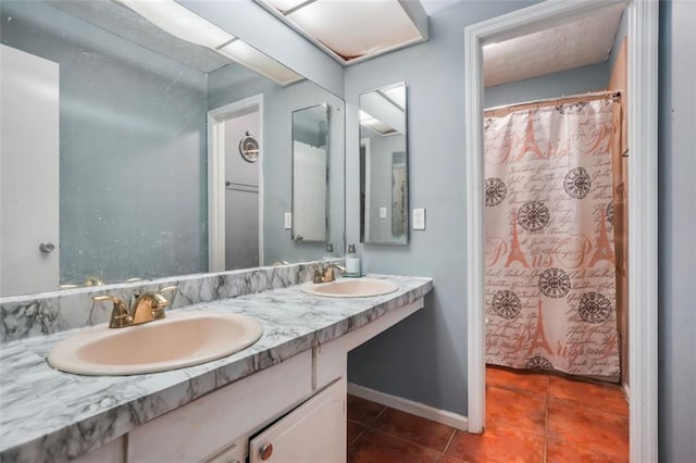 bathroom featuring tile patterned floors and vanity