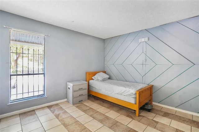 tiled bedroom featuring multiple windows