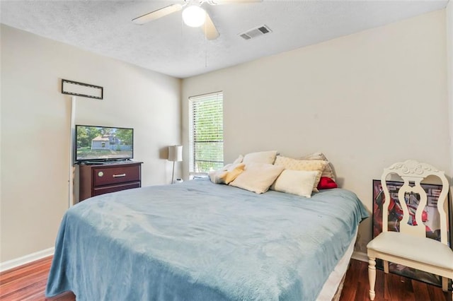 bedroom featuring ceiling fan and dark hardwood / wood-style flooring