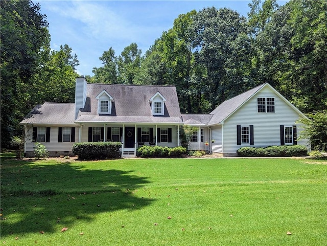 cape cod-style house with a front lawn and a porch