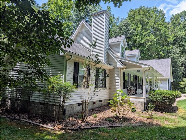 view of home's exterior featuring a porch