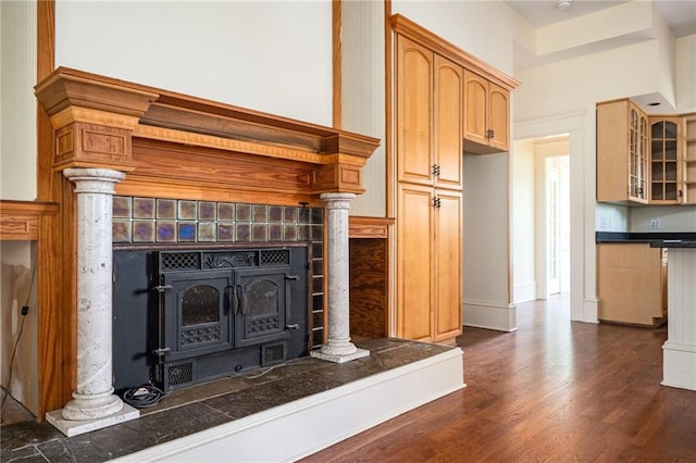 interior details with wood-type flooring and decorative columns