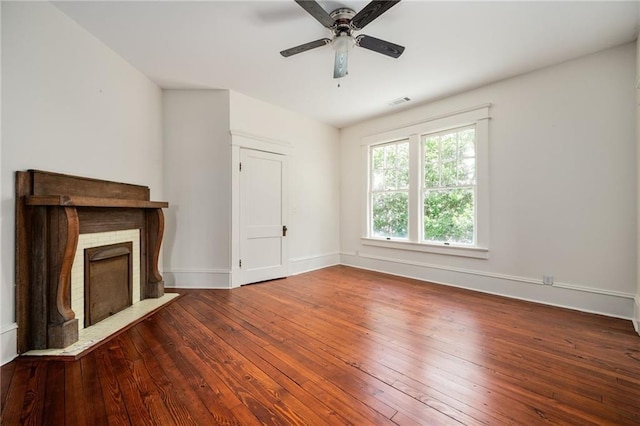 unfurnished living room with hardwood / wood-style flooring and ceiling fan