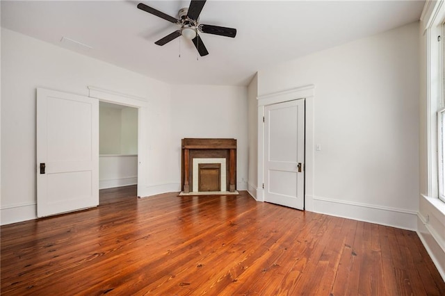 unfurnished living room featuring wood-type flooring and ceiling fan