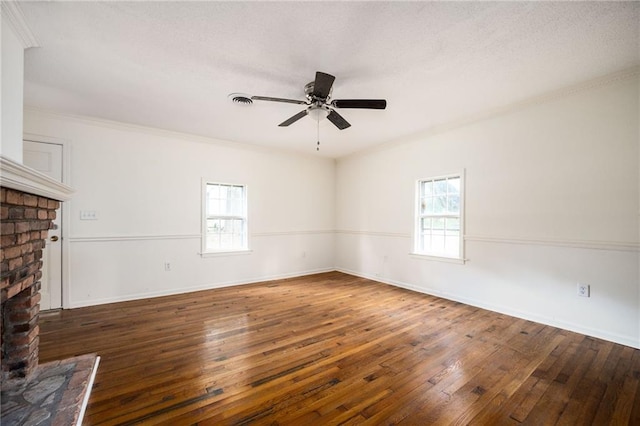 unfurnished living room featuring crown molding, dark hardwood / wood-style floors, and ceiling fan