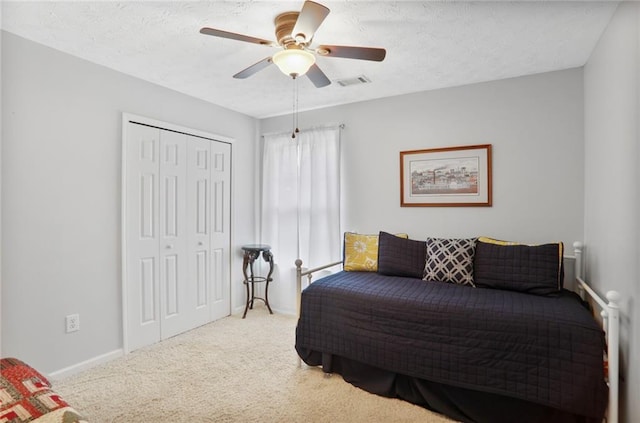1610 Trellis Xing, Alpharetta, GA 30004 - bedroom with a closet, carpet, a ceiling fan, and a textured ceiling