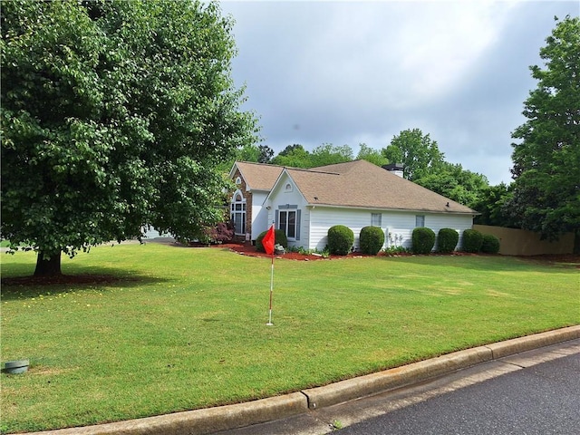view of home's exterior featuring a lawn