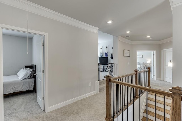 hallway featuring light carpet and ornamental molding