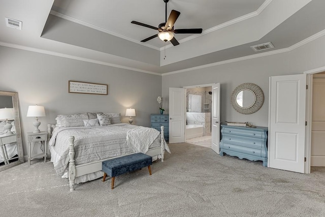 bedroom with ornamental molding, light colored carpet, a raised ceiling, and ceiling fan