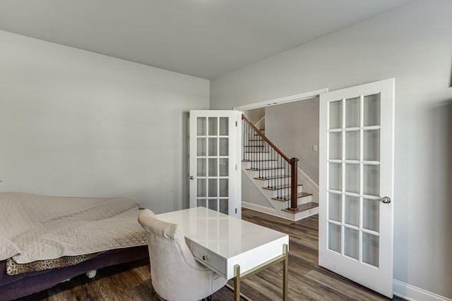 interior space with dark wood-type flooring and french doors