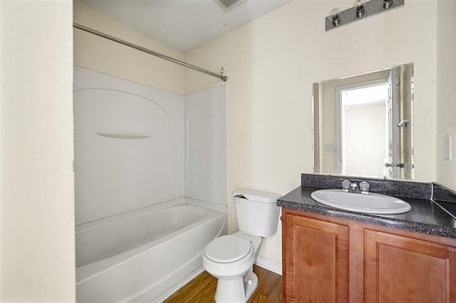 full bath featuring toilet, shower / tub combination, vanity, and wood finished floors