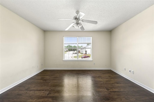 unfurnished room with dark wood-style flooring, a textured ceiling, a ceiling fan, and baseboards