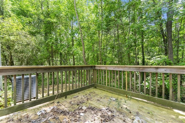 wooden deck with a forest view