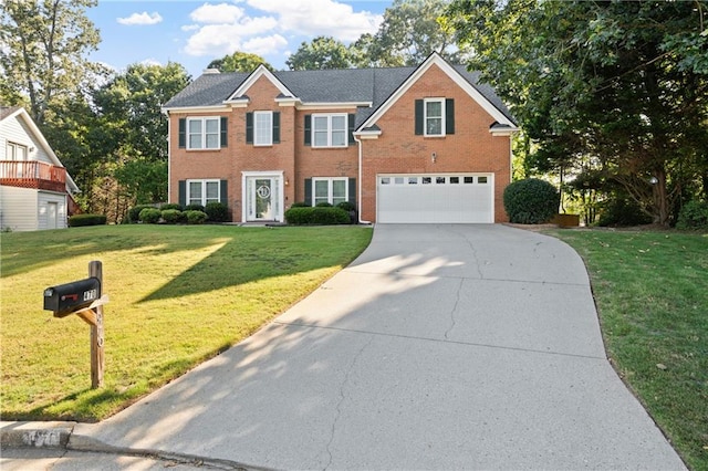 view of front facade featuring a garage and a front lawn