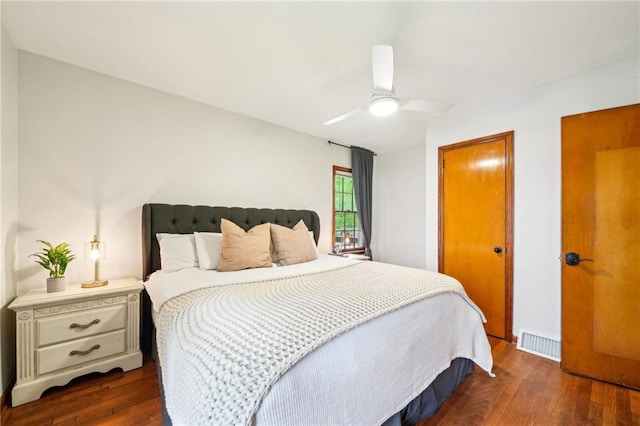 bedroom featuring dark wood-type flooring and ceiling fan