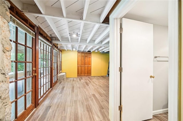 hallway with light wood-style floors