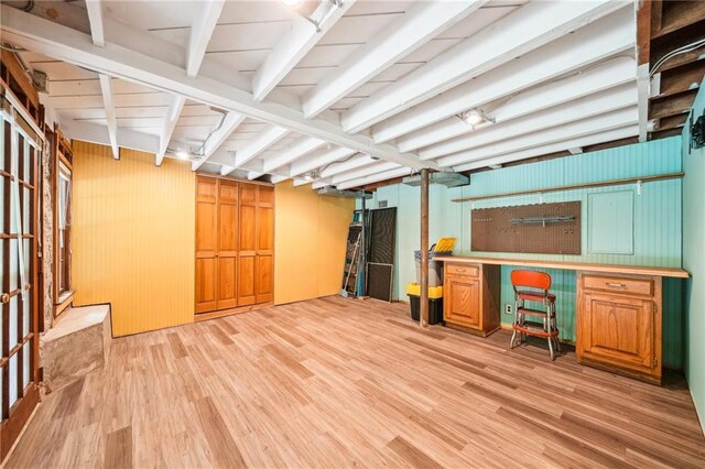 finished basement featuring light wood-type flooring