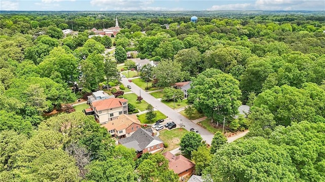 aerial view of property's location with a forest