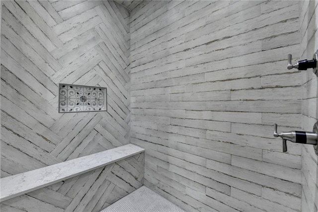 interior details featuring a sauna and tiled shower