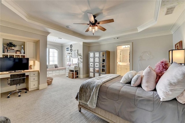 bedroom featuring a raised ceiling, crown molding, visible vents, and light carpet