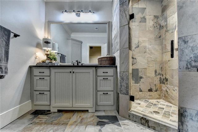 bathroom featuring vanity, a shower stall, marble finish floor, and ornamental molding