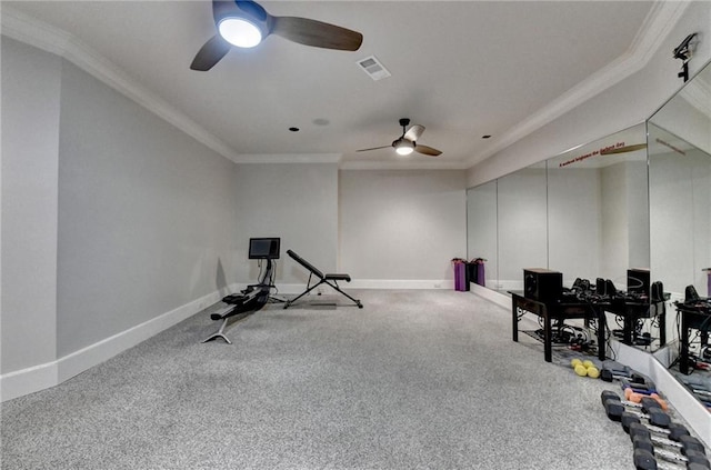 workout area with crown molding, carpet, baseboards, and visible vents