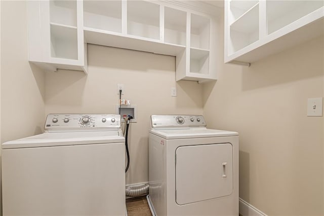 washroom with laundry area and washing machine and dryer