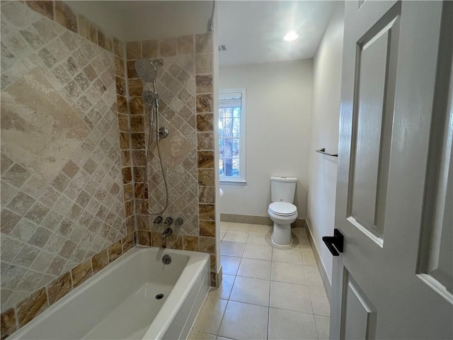 bathroom featuring toilet, shower / tub combination, baseboards, and tile patterned floors