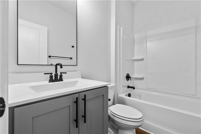 full bathroom featuring vanity, toilet, and shower / bathtub combination