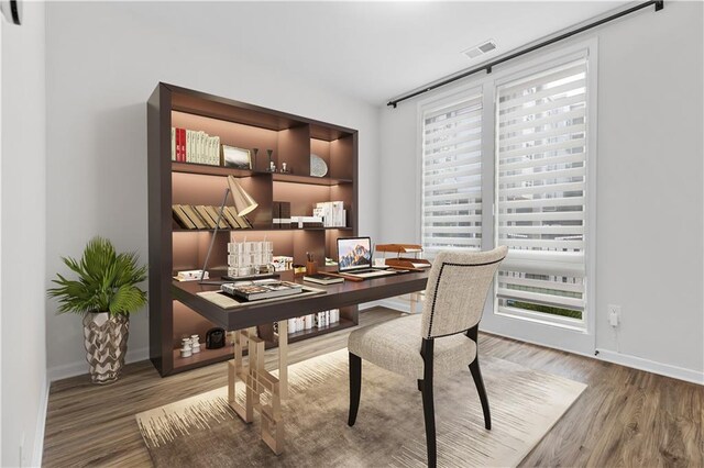 office space featuring wood-type flooring and a wealth of natural light