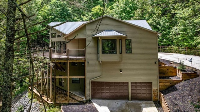 10323 Grassy Mountain Rd, Ellijay, GA 30540 - rustic home featuring a garage, driveway, and a metal roof