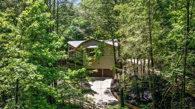 10323 Grassy Mountain Rd, Ellijay, GA 30540 - view of side of property with a view of trees and concrete driveway