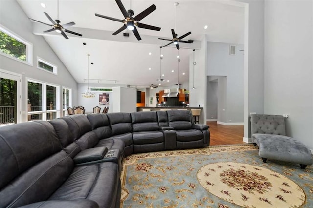 10323 Grassy Mountain Rd, Ellijay, GA 30540 - living room featuring wood finished floors, healthy amount of natural light, high vaulted ceiling, and ceiling fan