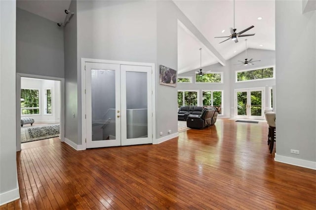 10323 Grassy Mountain Rd, Ellijay, GA 30540 - living area featuring high vaulted ceiling, french doors, ceiling fan, hardwood / wood-style flooring, and healthy amount of natural light