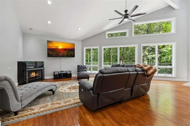 10323 Grassy Mountain Rd, Ellijay, GA 30540 - living area with hardwood / wood-style floors, ceiling fan, a warm lit fireplace, high vaulted ceiling, and recessed lighting