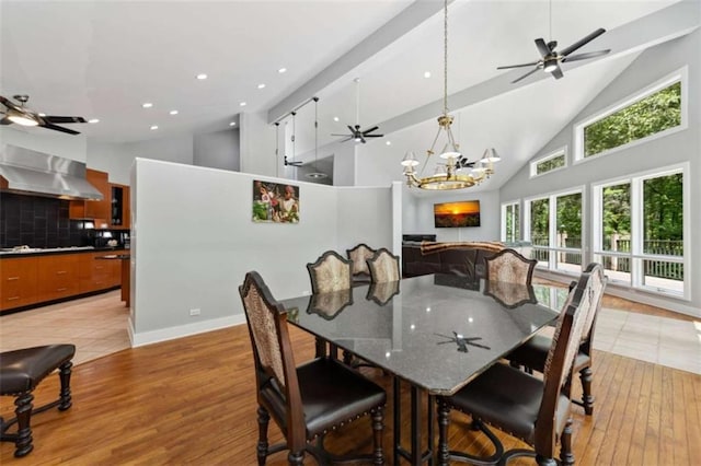 10323 Grassy Mountain Rd, Ellijay, GA 30540 - dining area with high vaulted ceiling, light wood-style flooring, a chandelier, and recessed lighting