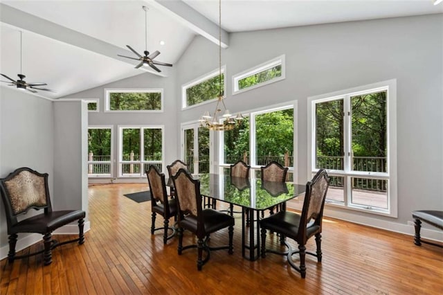 10323 Grassy Mountain Rd, Ellijay, GA 30540 - dining area featuring beamed ceiling, a chandelier, high vaulted ceiling, hardwood / wood-style flooring, and a ceiling fan