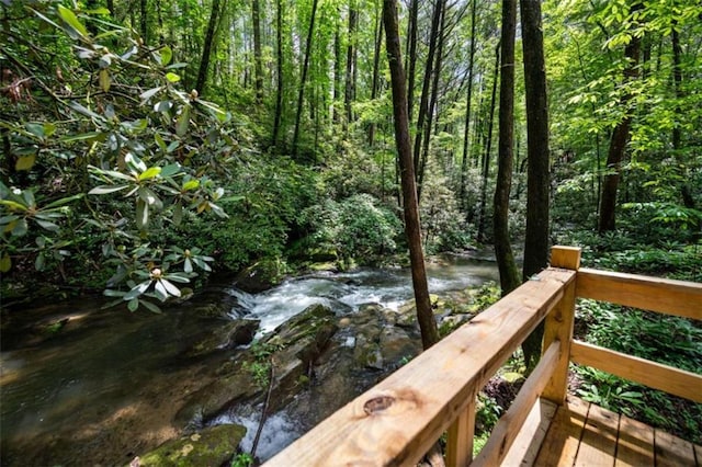 10323 Grassy Mountain Rd, Ellijay, GA 30540 - wooden terrace featuring a wooded view