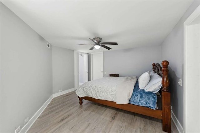 10323 Grassy Mountain Rd, Ellijay, GA 30540 - bedroom with light wood-style floors and ceiling fan